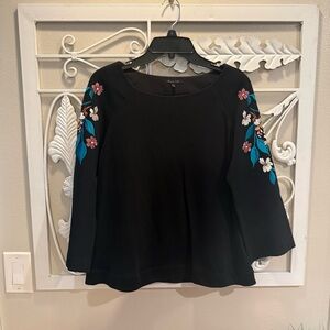 Elegant Black Blouse with Floral Accents